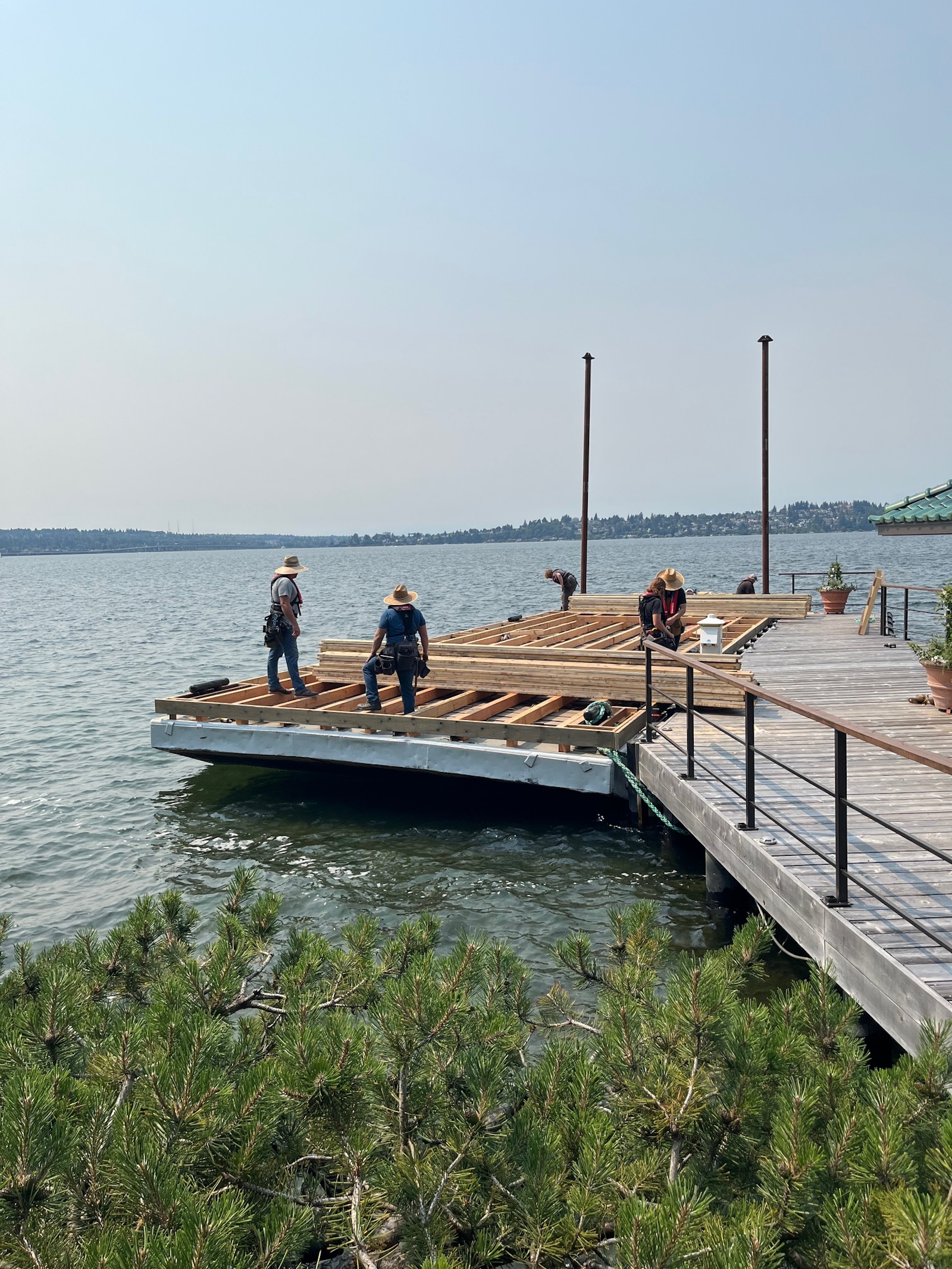 WCI crew constructing a floating wedding and event barge on a Northwest waterfront